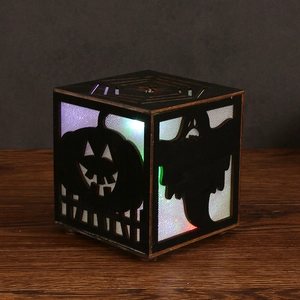 Halloween wooden pumpkin light box with ghost and spider web laser-cut patterns