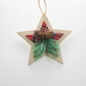 Detail of wooden star Christmas ornament with pine cones and red-black buffalo plaid fabric