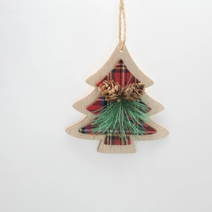 Detail of wooden Christmas tree ornament with red plaid fabric, pine cones and pine needles