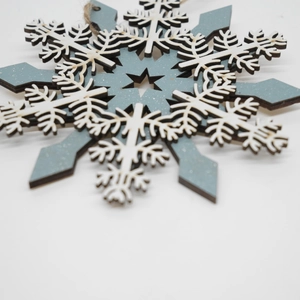 Dual-layer laser cut wooden snowflake ornament with rustic jute hanging twine for decor