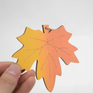 Handmade wooden maple leaf pendant with yellow gradient finish and rustic twine rope