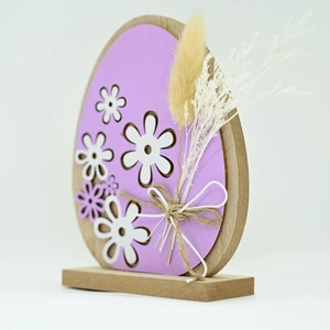 Detail of Easter egg-shaped wooden ornament with lavender finish and floral cutout