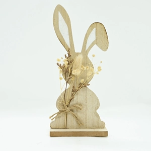 Detail of wooden Easter bunny with natural grain, jute bow, and dried flower bouquet