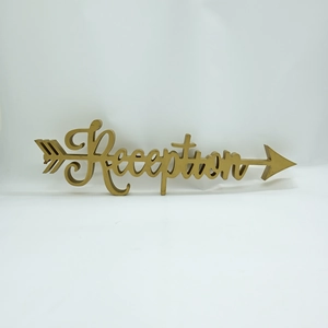 Close-up of golden wooden reception arrow sign with elegant script for wedding decor