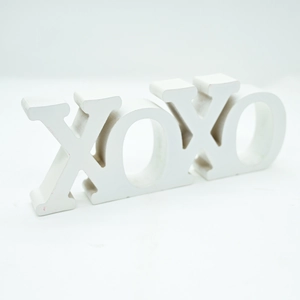 Detailed view of white XOXO wooden letter ornament for Valentine home decor