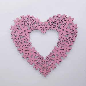 Pink heart-shaped laser-cut wooden ornament with floral pattern and jute rope