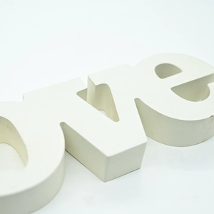 Close-up of white 3D LOVE wooden letter ornament for romantic wedding home decor