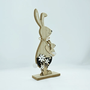 Close-up of wooden Easter rabbit with pom-pom tail and rustic twine bow detail