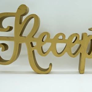 Detail of 3D gold wedding reception wooden letter sign with elegant cursive typography