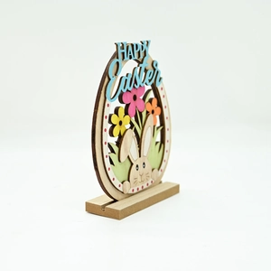Close-up of laser-cut multilayer wooden Easter ornament with Happy Easter text and bunny