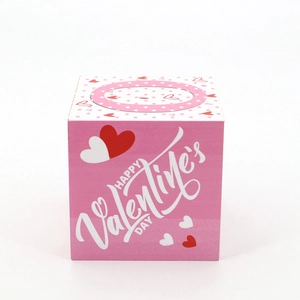 Macro shot of wooden square Valentine's Day decor with Happy Valentine's Day typography