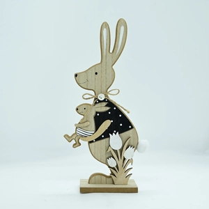 Detailed view of handcrafted wooden Easter bunny with polka dots and jute bow decoration