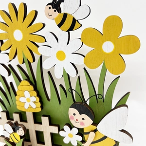 3D layered wooden Easter decoration with sunflower, bee and white fence floral design