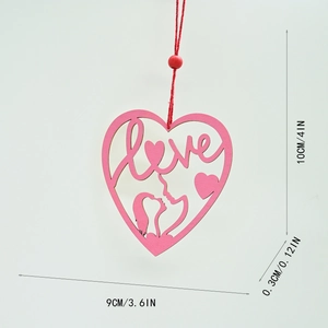 Detail of pink wooden Ferris wheel heart ornament with Love engraving and couple silhouette