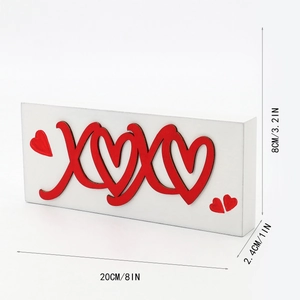 White wooden XOXO tabletop decoration with red hearts for Valentine's Day decor