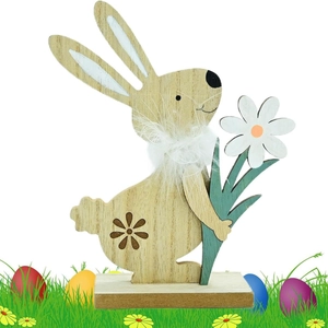 Easter wooden bunny ornament with flower pattern and white feather detail on grass base