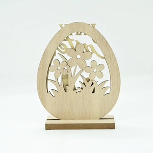 Detail of wooden Easter egg ornament with laser-cut flower patterns and sturdy base