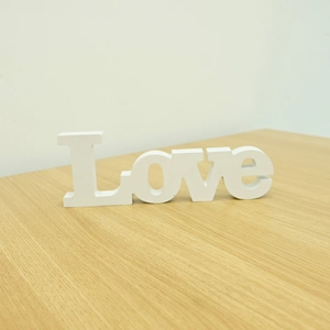 3D white wooden Love letter sign standing on a wooden desk for home wedding decor