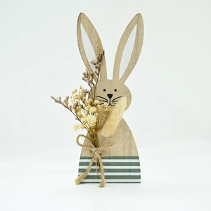 Detail of wooden Easter rabbit with natural grain, jute bow and dried flowers