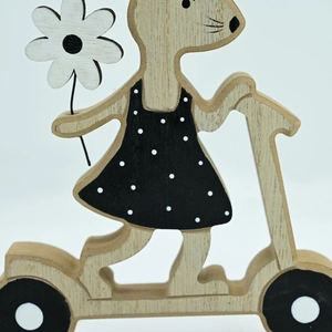 Close-up of wooden mouse ornament on scooter with laser-cut textures and floral detail