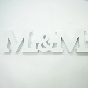 Detailed view of white matte wooden MR & MRS wedding letters for table decoration