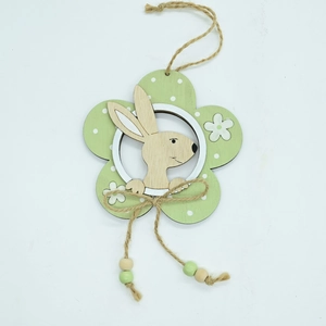 Detail of wooden Easter bunny ornament with green floral pattern and hemp rope beads