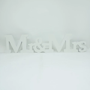Detail view of white matte wood Mr & Mrs freestanding letters for wedding decor