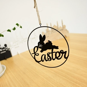 Detail of Easter metal wreath hanging decor with rabbit silhouette and artistic lettering