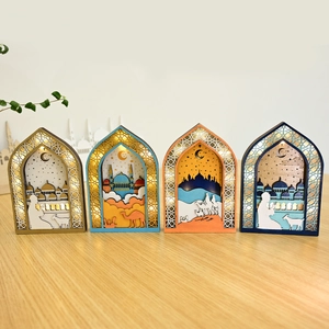 Detail of wooden Ramadan LED lanterns with laser-cut mosque and desert camel scenes