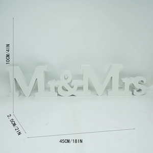 White wooden Mr & Mrs wedding decor sign showing height 10cm and length 45cm dimensions