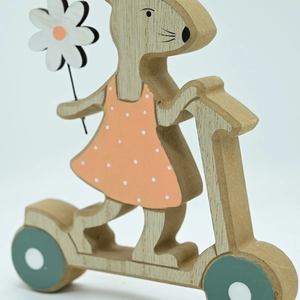 Detail of wooden Easter rabbit on scooter with daisy and polka dot dress ornament