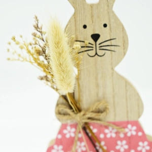 Detailed macro view of Easter wooden bunny ornament with dried flowers and jute twine bow