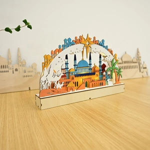Detail of wooden LED moon lamp with blue mosque silhouette and warm glowing night light
