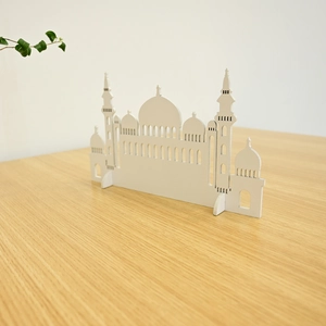 Detailed view of white minimalist mosque silhouette wooden ornament for home decoration