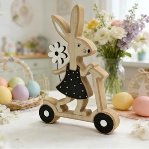 Easter wooden bunny on a scooter decoration with black polka dot dress for home decor