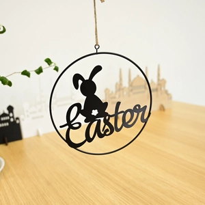 Hanging Easter wreath decoration with black metal bunny silhouette and rustic jute rope