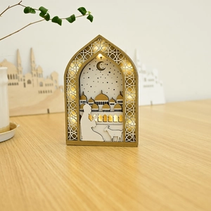 Macro detail of wooden Muslim Eid LED lantern with mosque and star moon silhouette