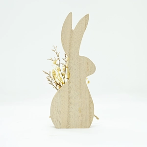 Detail of wooden Easter bunny ornament showing natural wood grain and dried flower insert