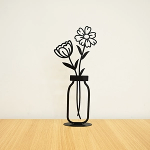 Modern black metal wall art featuring minimalist flower silhouettes with a round stand base