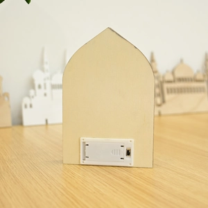 Detail of wooden LED ornament back showing battery compartment with CE certification