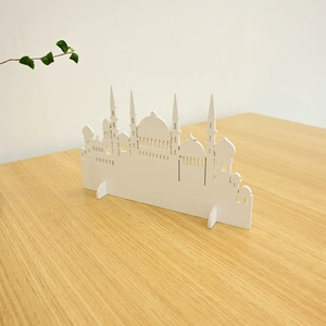 Detailed laser-cut white wooden mosque silhouette decor for Ramadan desktop ornament