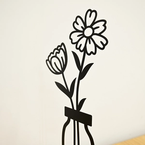 Modern minimalist black metal flower wall art set featuring 3D iron floral line sculptures