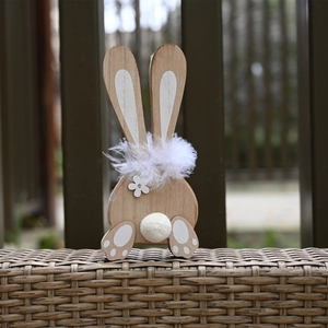Handcrafted wooden Easter bunny ornament with white feather collar and rustic wood grain