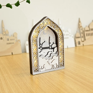 Macro view of multi-layered wooden Muslim LED decor featuring mosque and crescent patterns