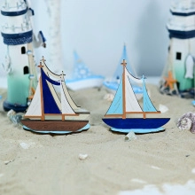 Detailed view of handcrafted wooden sailing boat models in a Mediterranean nautical style