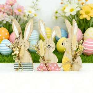 Three-piece Easter wooden bunny ornaments with colorful patterns on green grass
