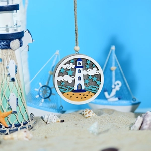 Detailed close-up of a wooden ocean lighthouse ornament with layered 3D carving design