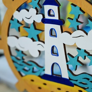 Macro shot of 3D multilayered wooden lighthouse ornament with sea themed nautical details