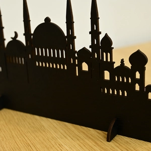 Detail of laser-cut wooden mosque silhouette ornament for Muslim home holiday decoration