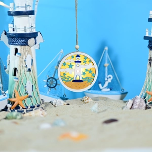 Detail of wooden LED nautical sphere lamp with lighthouse and ocean wave multilayer scene